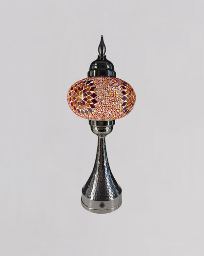 Decorative lamp with mosaic design on a gray background