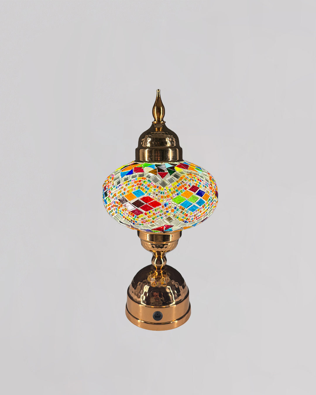 Decorative lamp with colorful mosaic design on a gray background