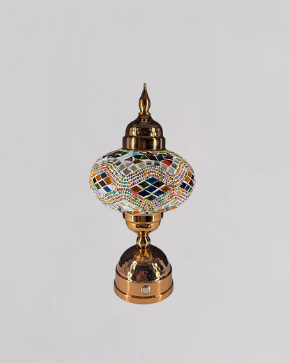 Decorative lamp with mosaic design on a gray background