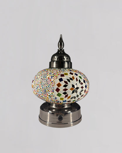 Decorative lamp with mosaic design on a white background