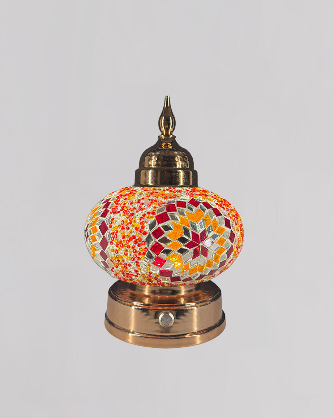 Decorative lamp with mosaic design on a white background