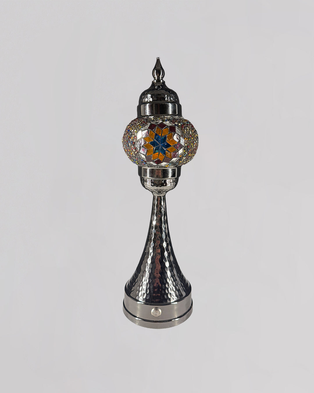 Decorative lamp with metallic and glass design on a white background