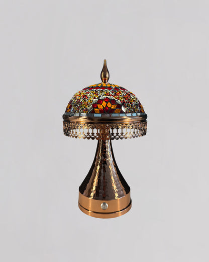 Decorative lamp with mosaic top on a gray background