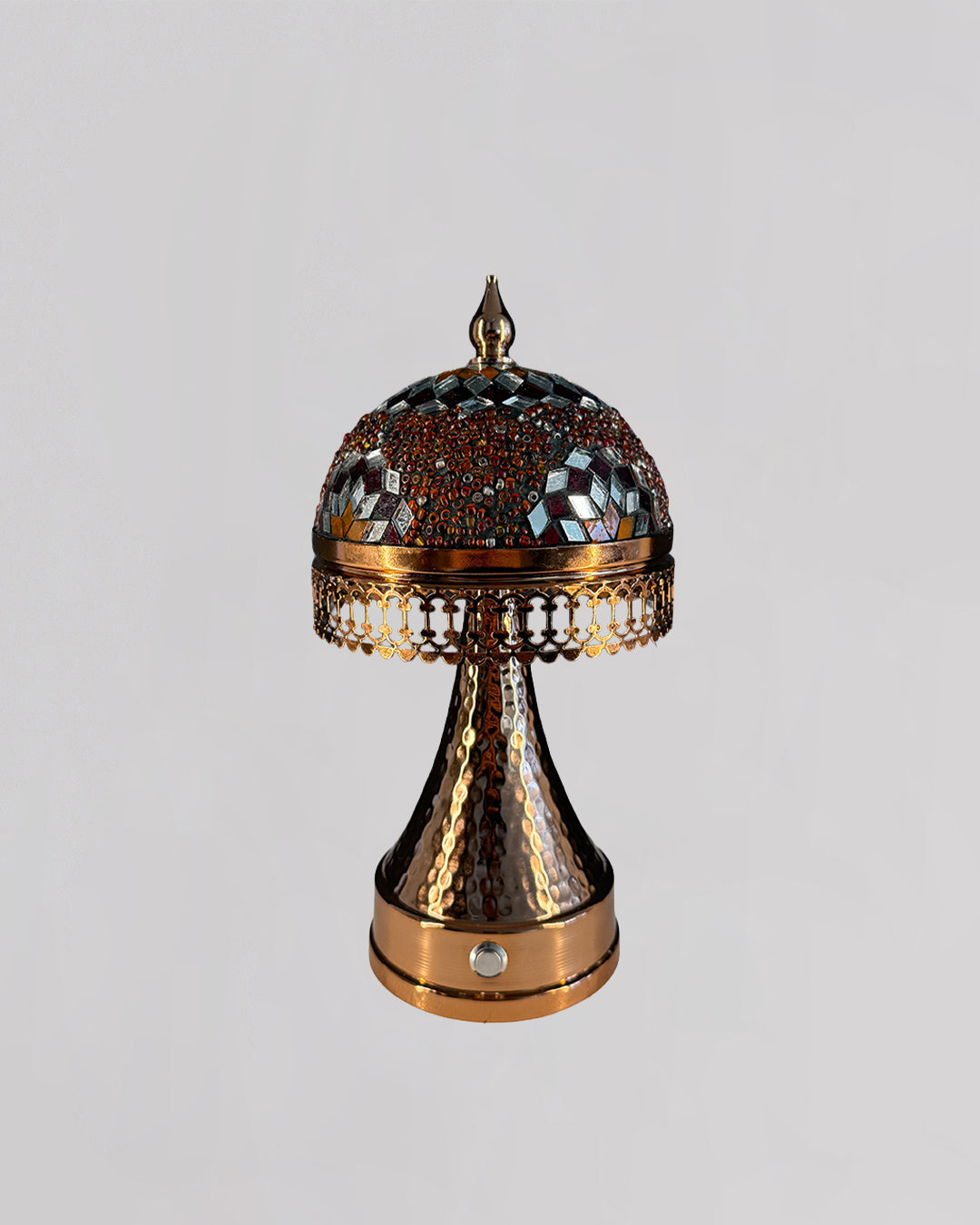 Decorative lamp with intricate design on a light gray background