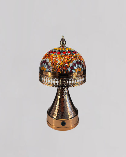 Decorative lamp with colorful mosaic top on a light gray background