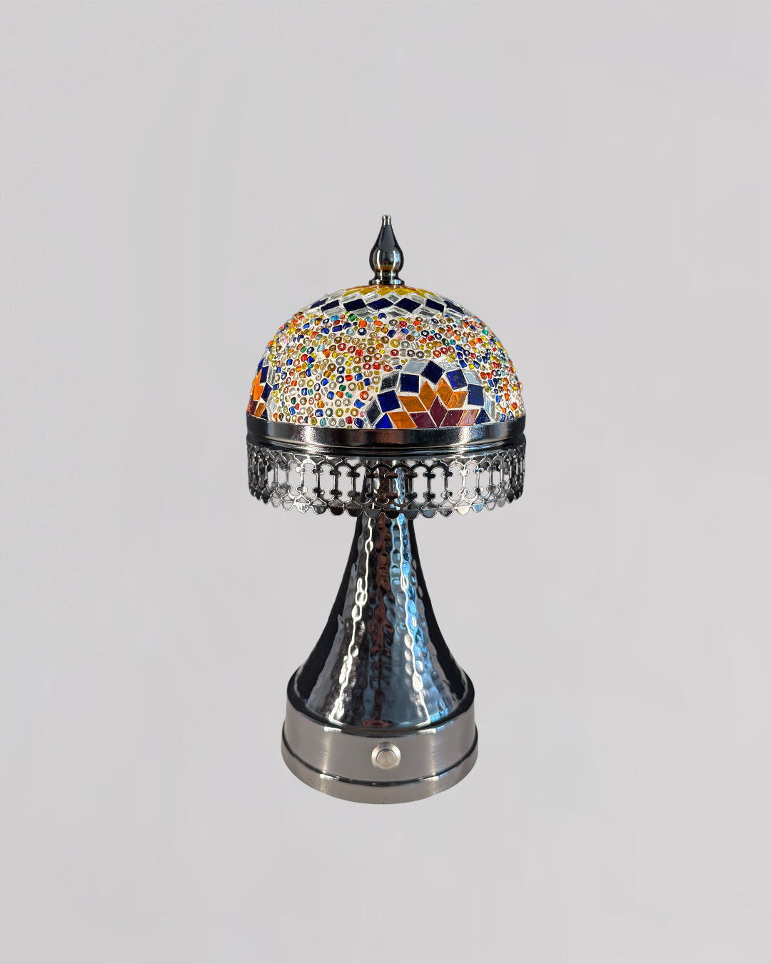 Decorative lamp with a colorful mosaic top on a gray background