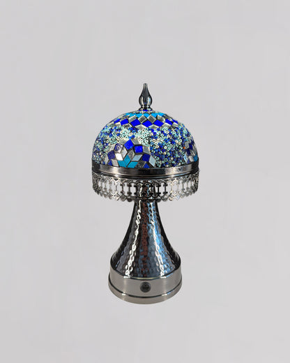 Decorative lamp with blue mosaic top on a gray background