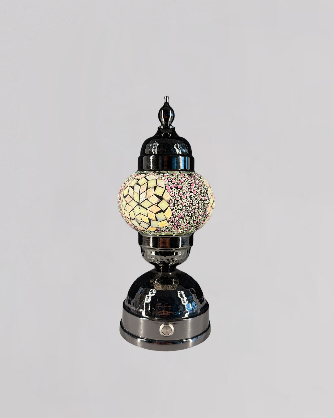 Decorative lamp with mosaic design on a gray background