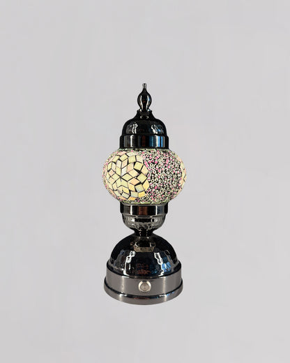 Decorative lamp with mosaic design on a gray background