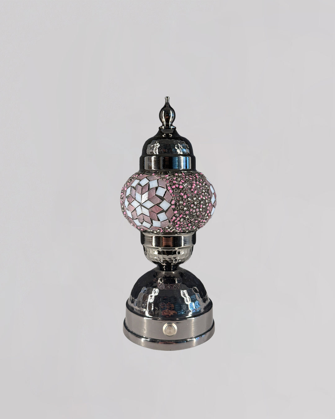 Decorative lamp with pink mosaic top on a white background